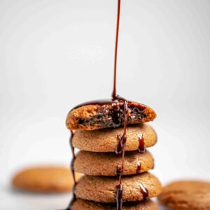 A chocolate syrup poured onto a stack of cookies